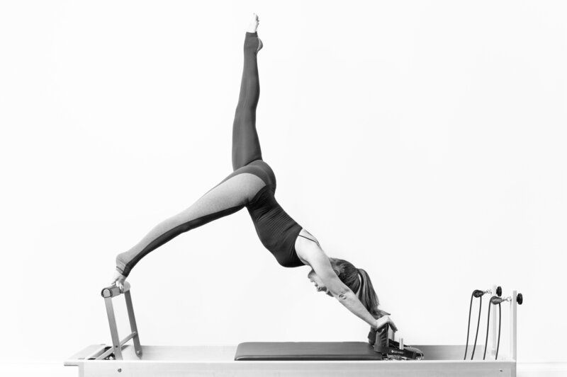 Pilates instructor stretching, black and white images