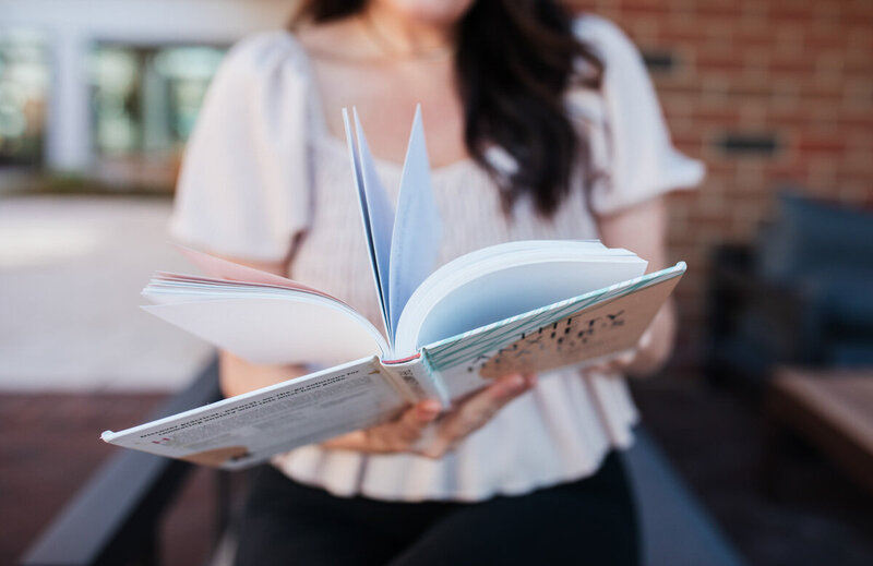 alison seponara hold her book