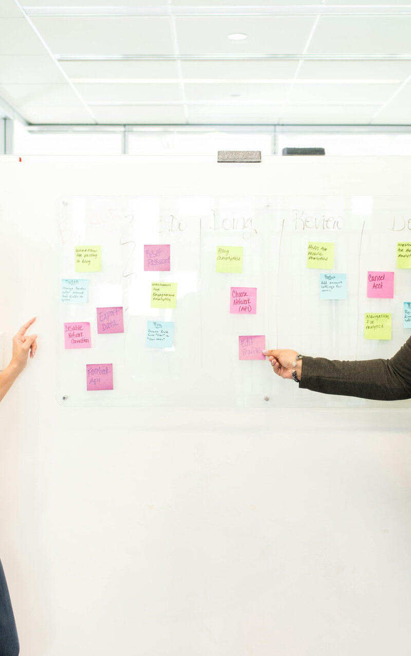 Cathy making a plan on the whiteboard