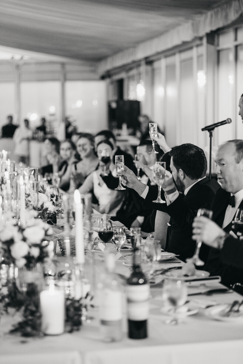 guests cheers at reception table 