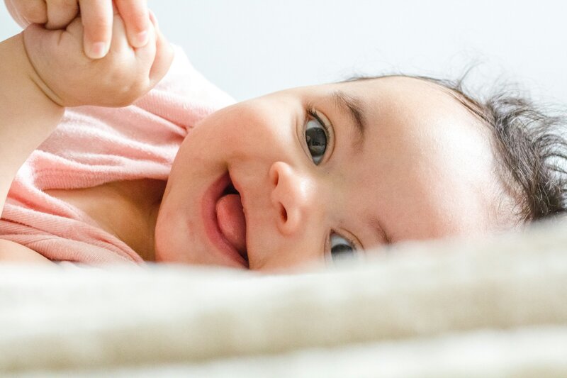 happy baby after successful sleep training services