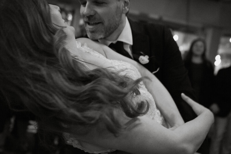Groom romantically dipping bride during first dance at luxury wedding venue in toronto, ontario