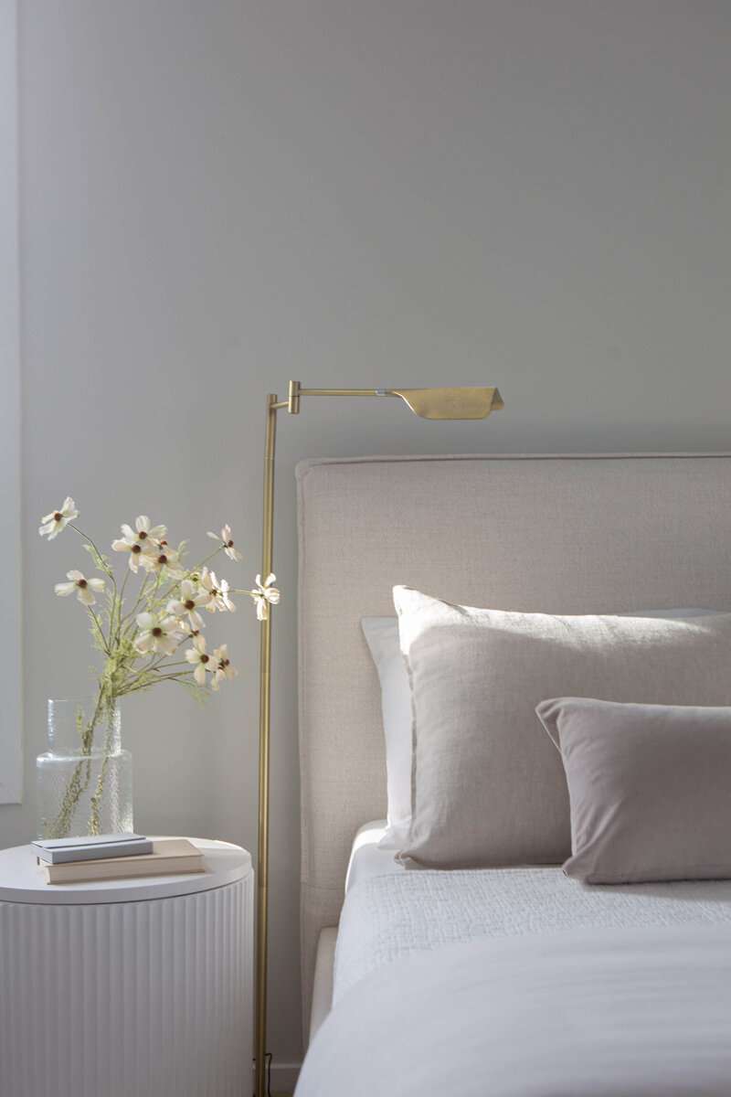 modern bedroom staging fluted side table with minimal bed