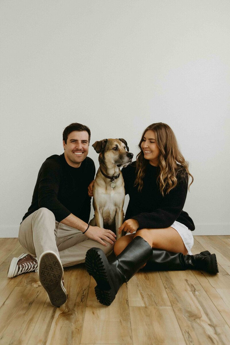 Hannah and Tyler seated with their dog, Oakland