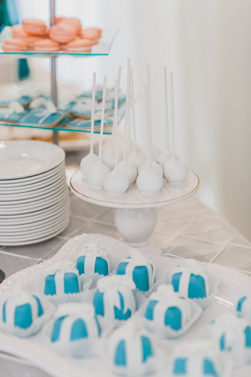 white cake pops with blue desserts and cookies
