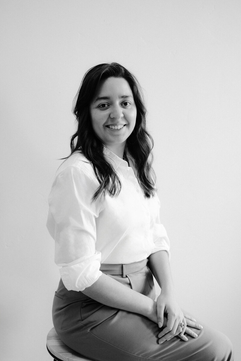 Photo of Gabriela seated on a staircase