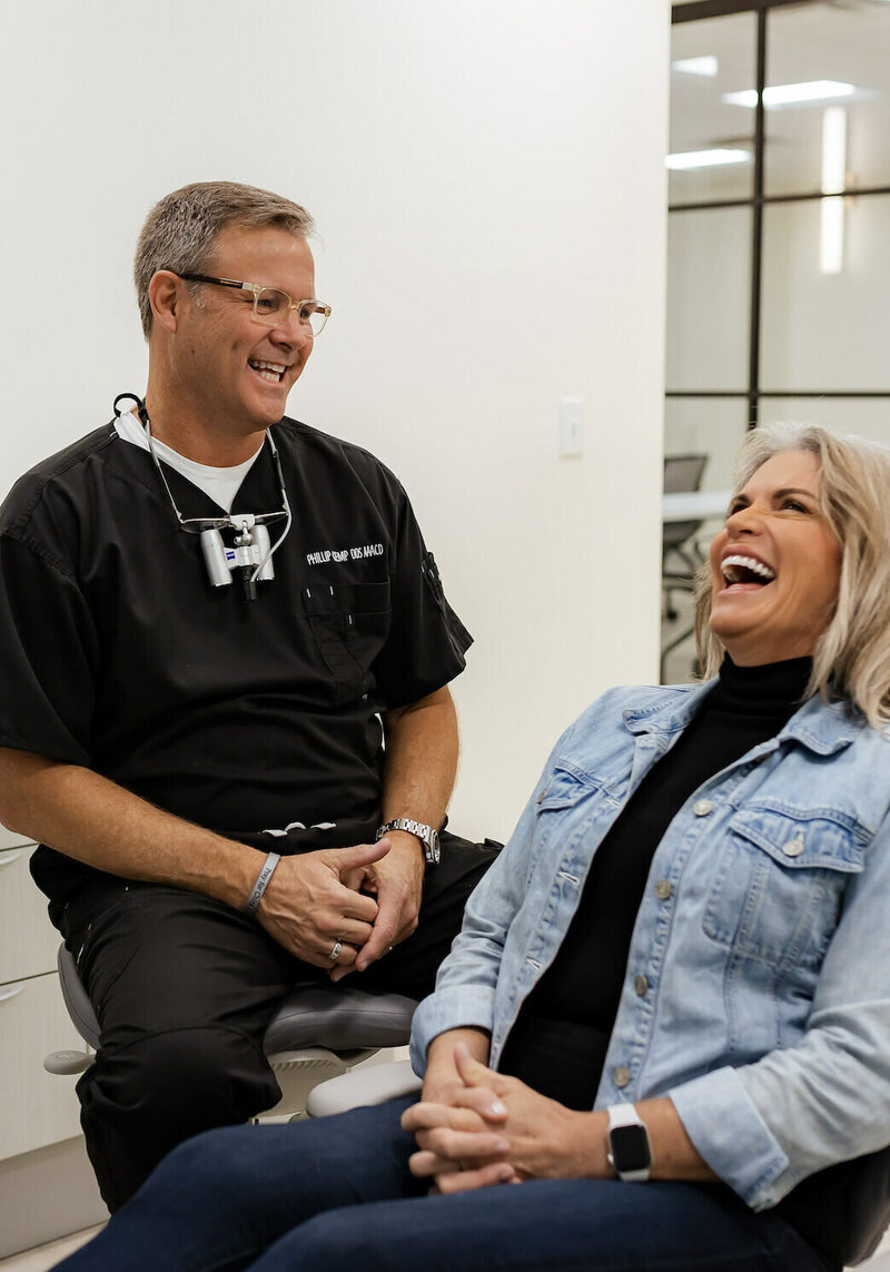 Dentist with smiling patient in Brentwood TN