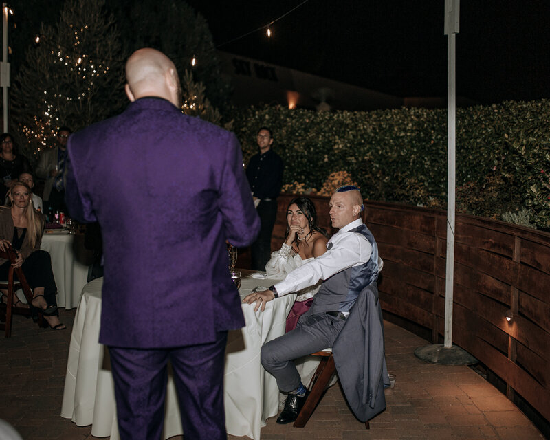 bride and groom reaction during toasts