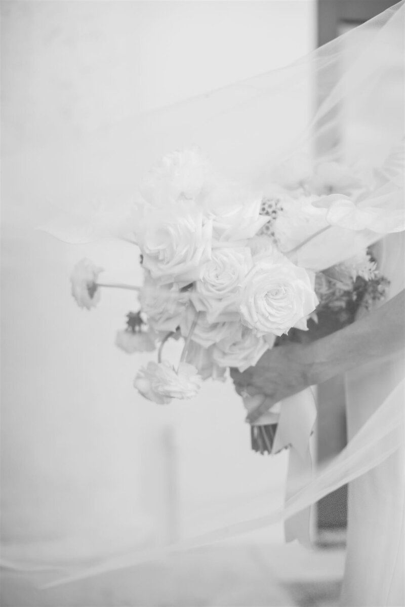 Bride's flowers in a black and white portrait by Orlando wedding photographer. 