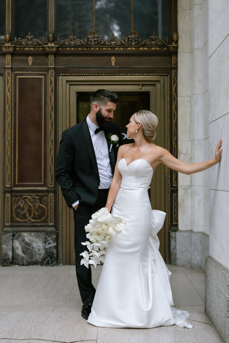Bride smiling on balcony at Westmoreland Club