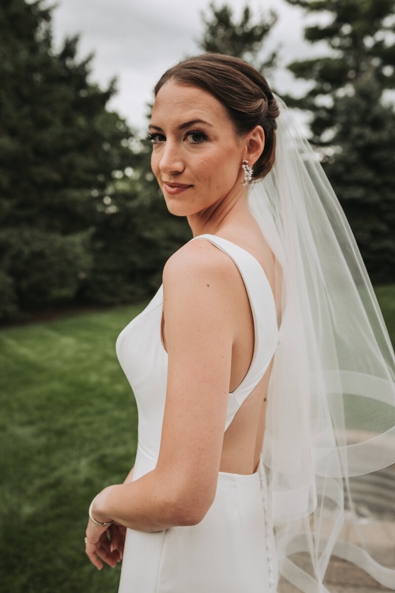 Portrait of the bride with her back facing the camera
