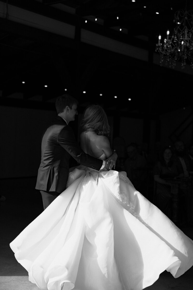 hands holding up wedding rings