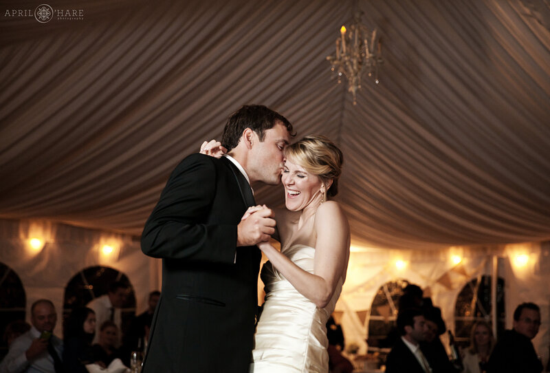 Dancing inside the large white tent at Boulder Creek Wedgewood Wedding Venue in Colorado