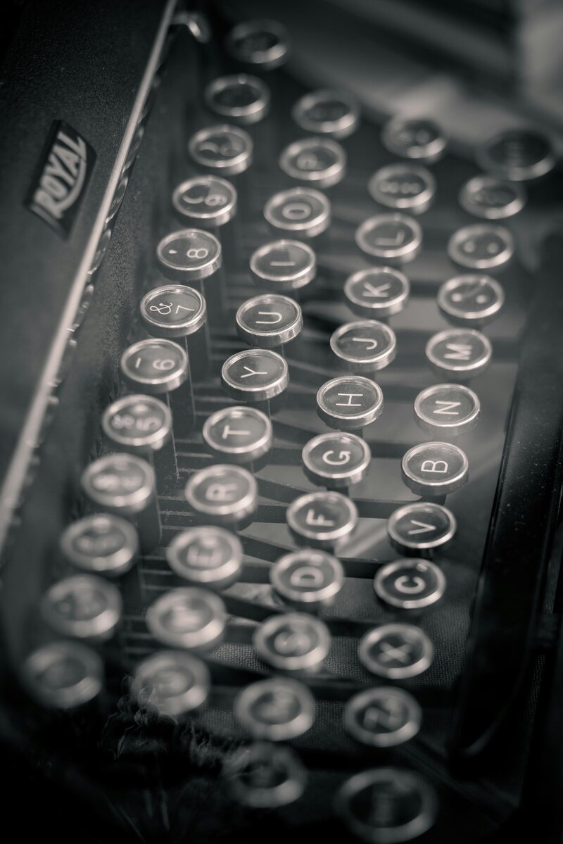 Close-up of vintage typewriter keys, symbolizing timeless attention to detail in copy editing and professional proofreading services.