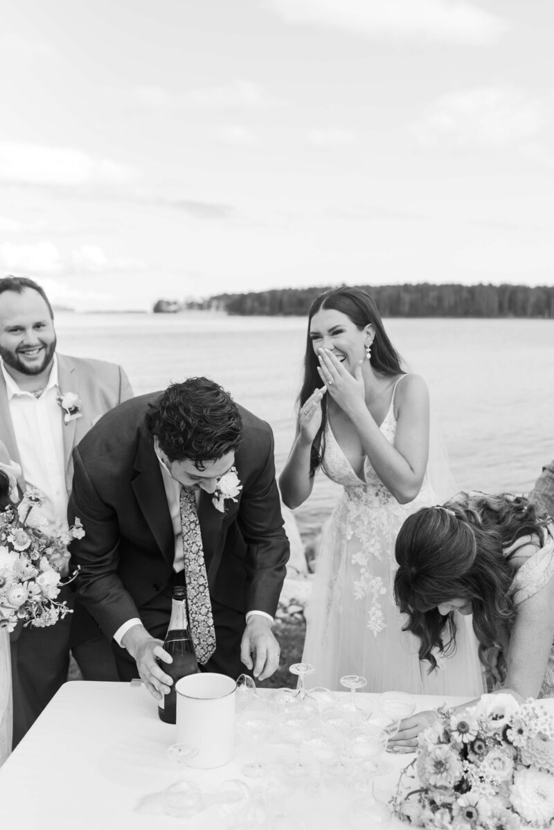 Bride and groom laughing at outdoor wedding reception at Halifax Nova Scotia