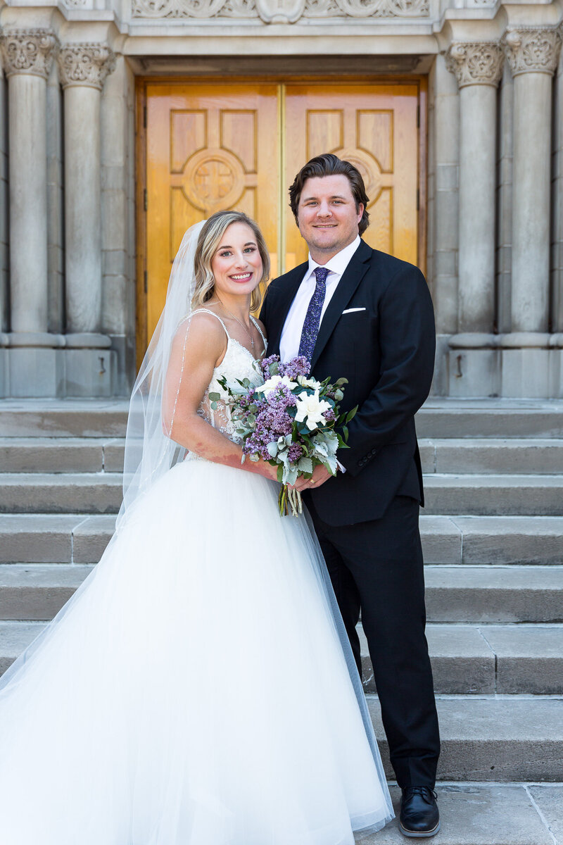 bride and groom portrait outside of st. john cantius church