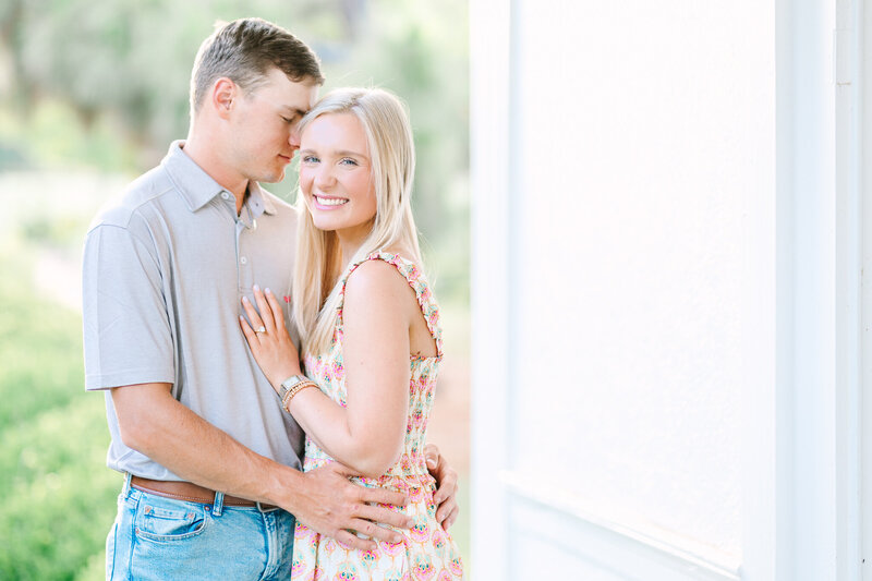 Engaged Couple embracing at Kiesel Park in Auburn AL | Wedding Photographer Amanda Horne