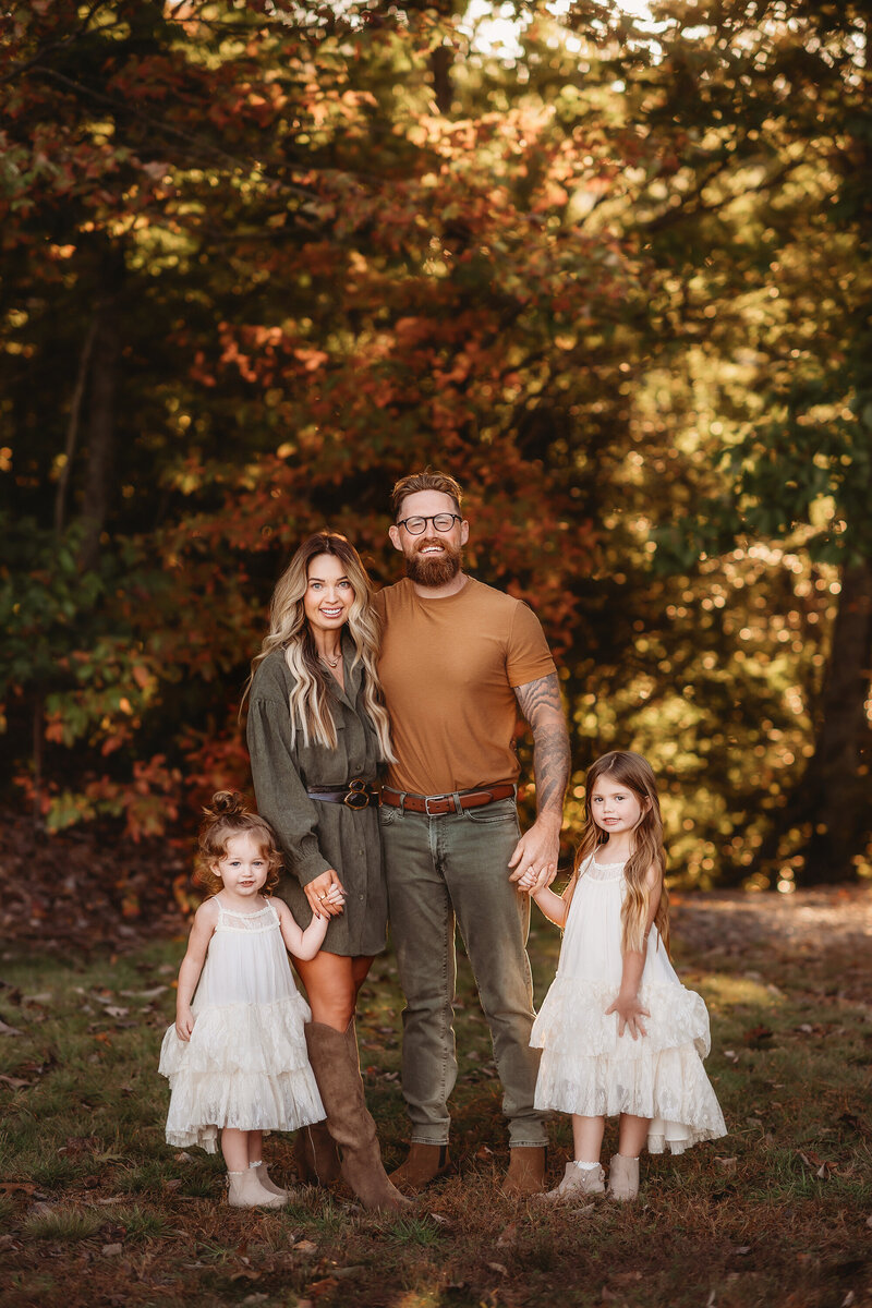 Sisters embrace during Fall Family Photos in Asheville, NC.
