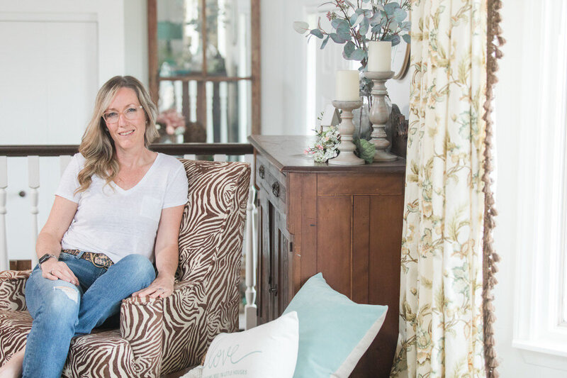 Kimberly Campbell Sitting in a Farmhouse Chic Livingroom