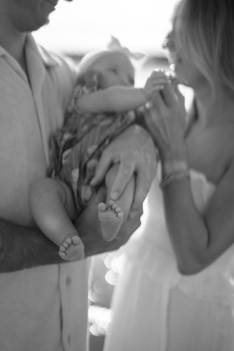 A family and their newborn on the beach in Stone Harbor, New Jersey.