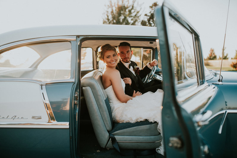 Northwest Arkansas couple heads off into the sunset in a classic car at their Hunt Chapel Wedding
