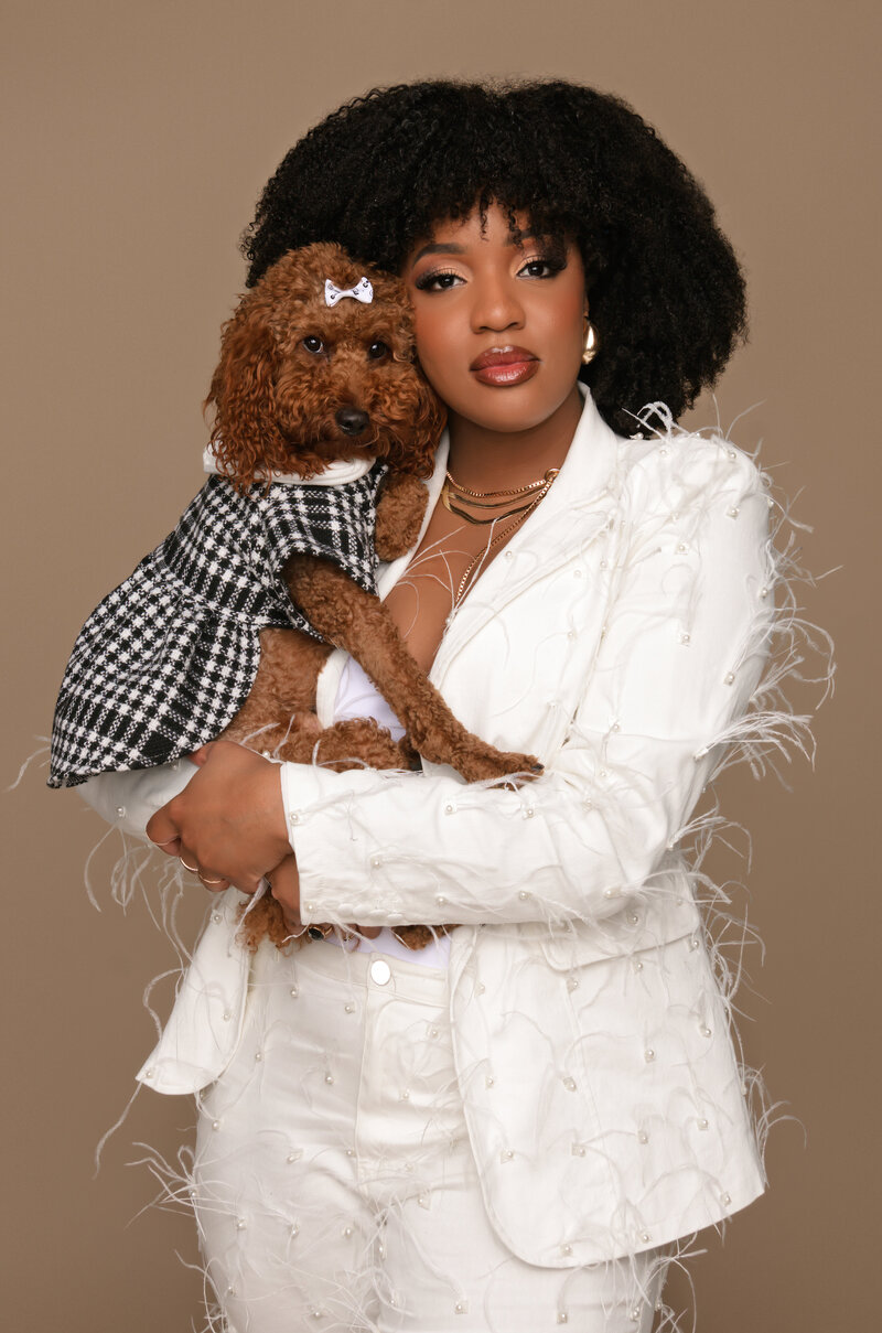 Branding portrait of a Seattle business owner with her beloved pet by her side, captured to reflect the warmth and personality she brings to her business every day.