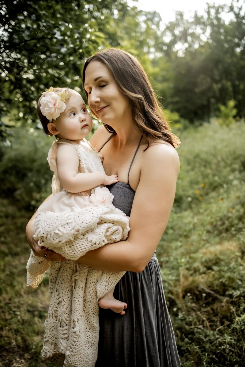 baby girl looks at the camera