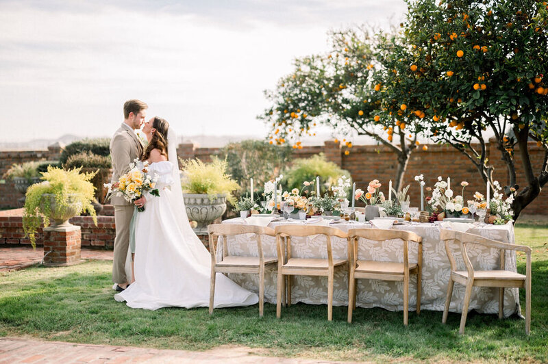 italian countryside wedding aesthetic. dreamy tablescapes with ikebana floral designs, fruits, taper candles. fine art floral design for intimate brunches, corporate events, brand activations, private events, & weddings in Scottsdale Arizona. artful floral design for weddings and events in tucson arizona