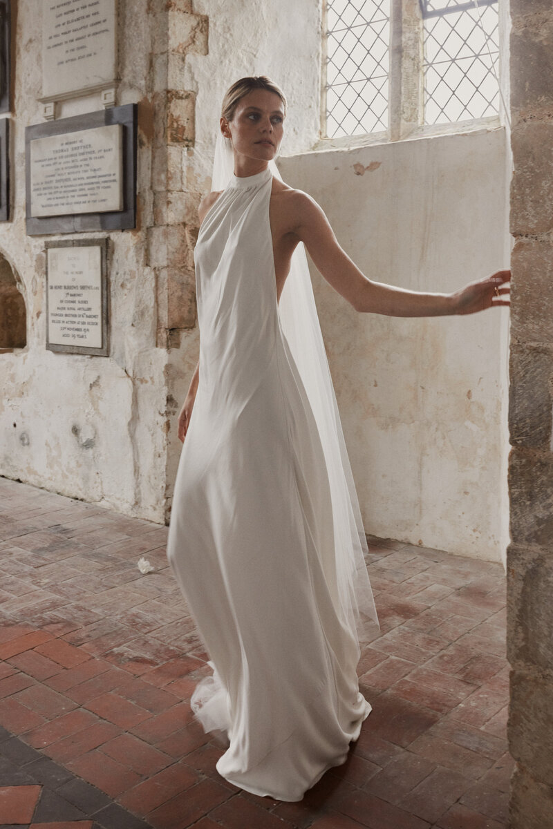 Long, silk wedding dress on natural bride by british wedding dress designer, Luna Bea