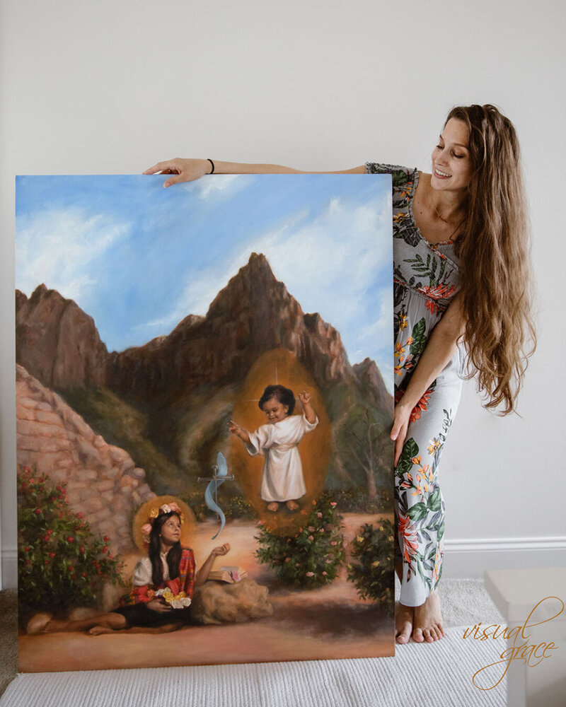 woman standing with artwork
