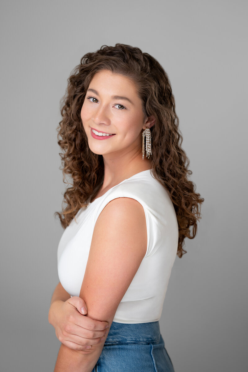 Young girl smiles for her pageant headshot