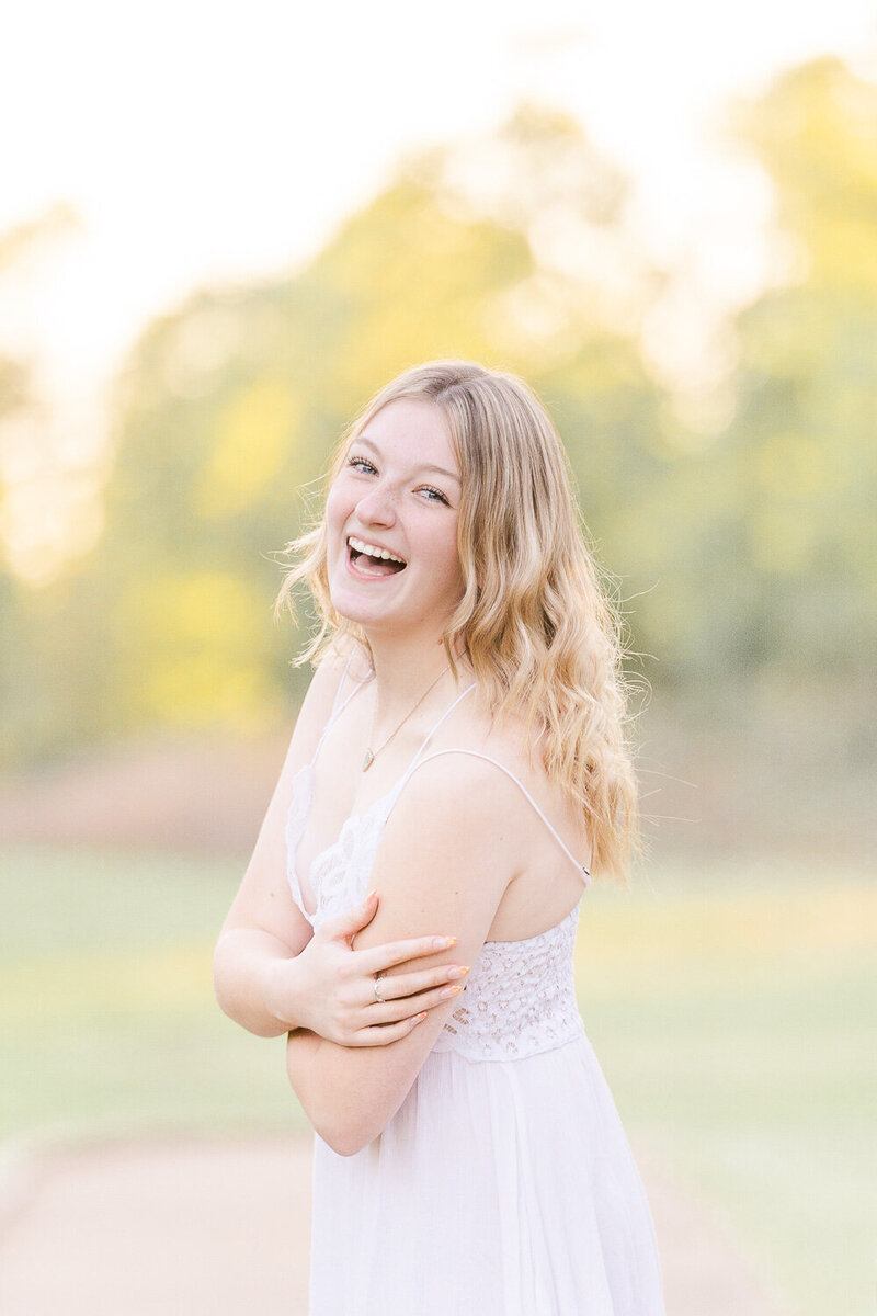 high school girl laughing taken by a senior photographer in Loudoun County, Virginia