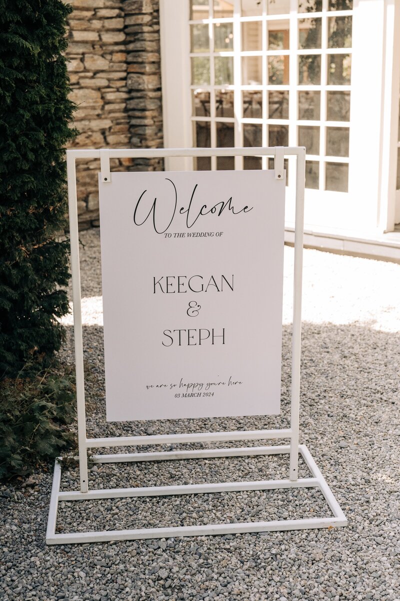 a welcome black and white wedding sign in queenstown