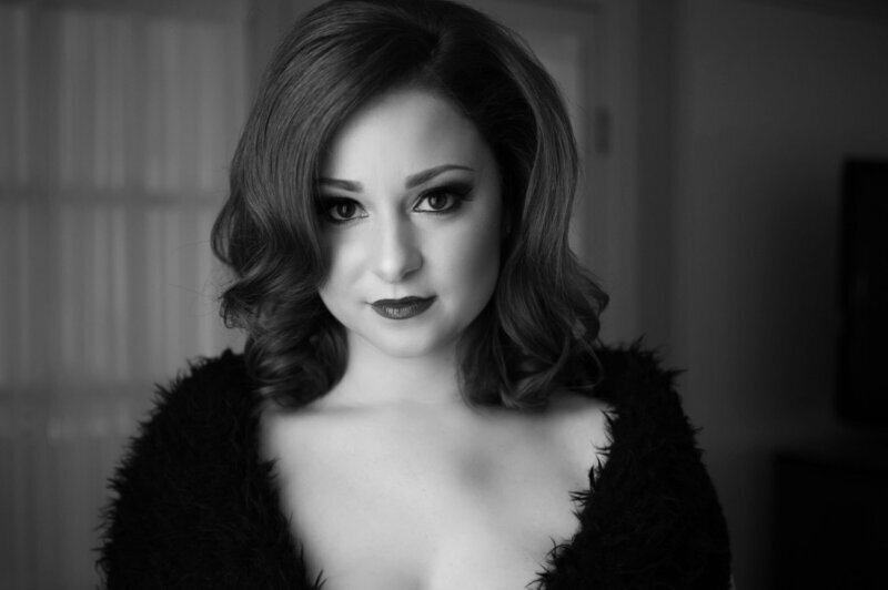 Boudoir glamour portrait of a woman standing at Gina Spanos’ Burnaby studio — luxury Vancouver boudoir photography session featuring natural light and soft, confident posing.
