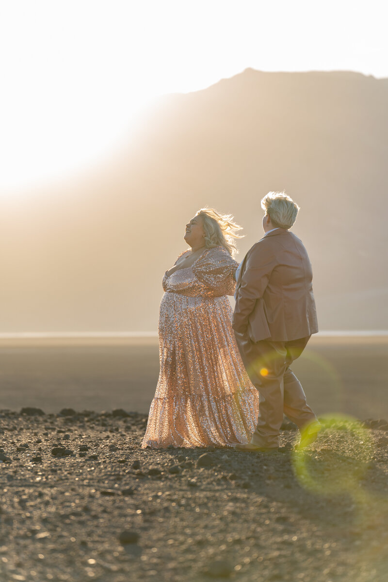 A couple laughing together in the desert