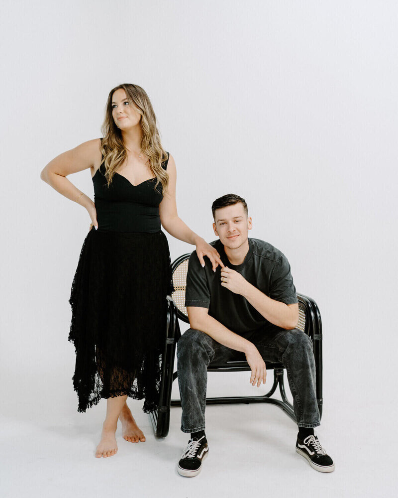 husband and wife fort myers florida photographers posing in studio