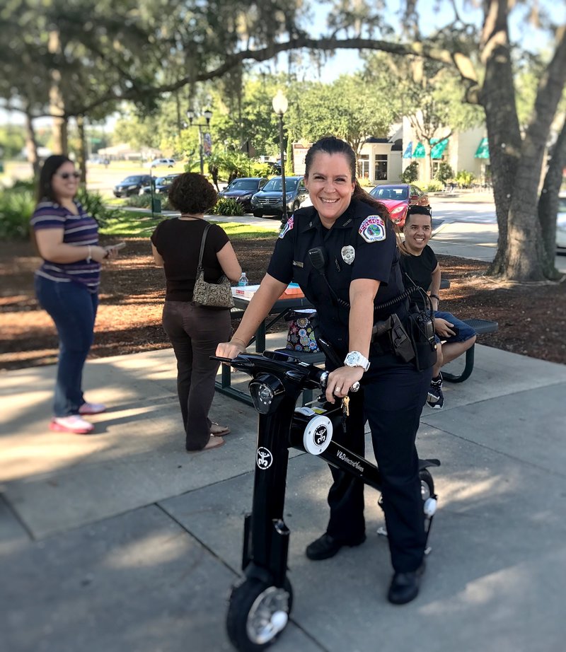 Police officer taking a ride on a Black Go-Bike M1