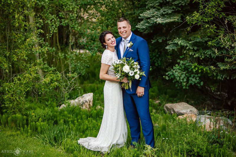 Cute couple laugh on their wedding day at Blackstone Rivers Ranch in Idaho Springs