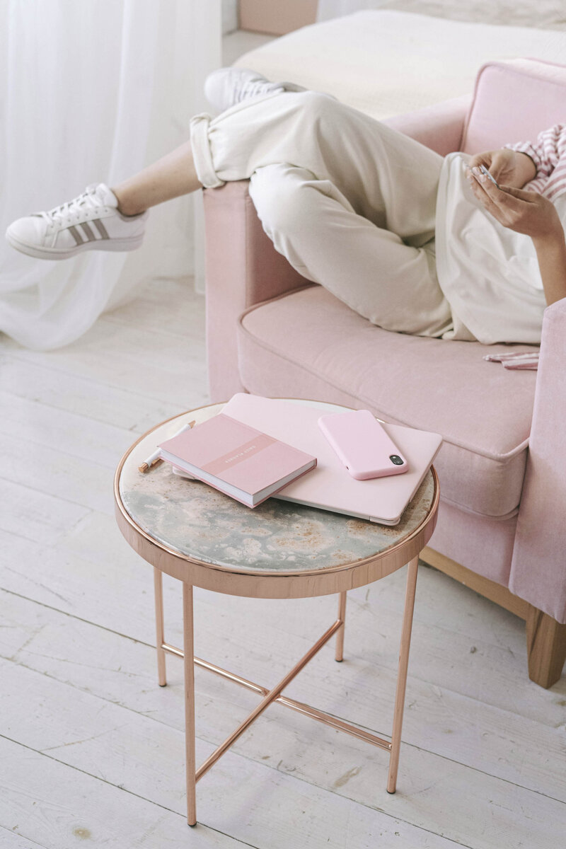 Teenage girl in a pink chair with pink accessories