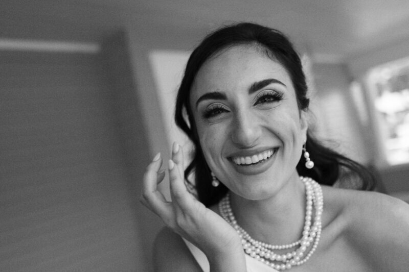 bride laughing by film wedding photographer Noble Photo Co