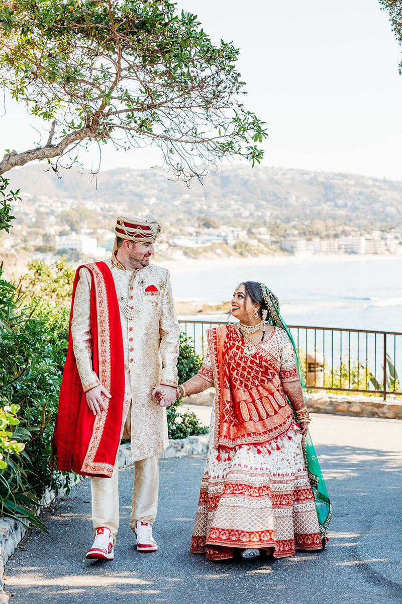 Groom walks hand in hand with his bride to be