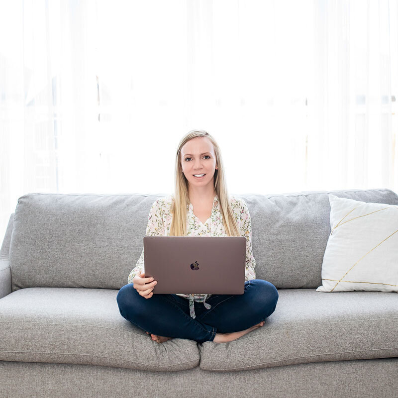 Marley Langford on a sofa with a  laptop computer for a PPC strategy call