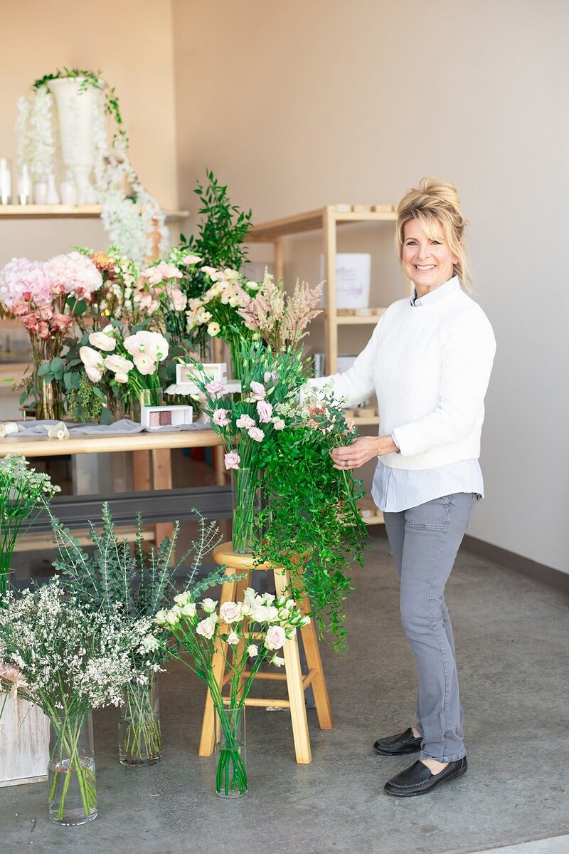 Branding photoshoot with florist selecting flowers for a bouquet