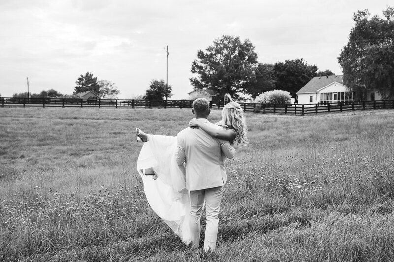 honeymoon-hold-bride-and-groom-1