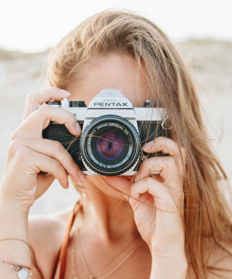 photo of a woman with a camera