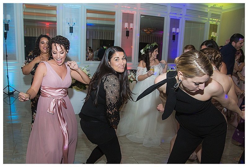 Dawn, a Jupiter wedding photographer, dancing at a reception