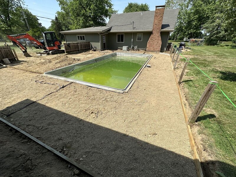 Pool deck prep: grading the base around an in-ground pool in Goshen, IN