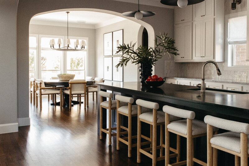 Modern, high contrast kitchen and dining room designed by Hope Miriam Designs in DFW