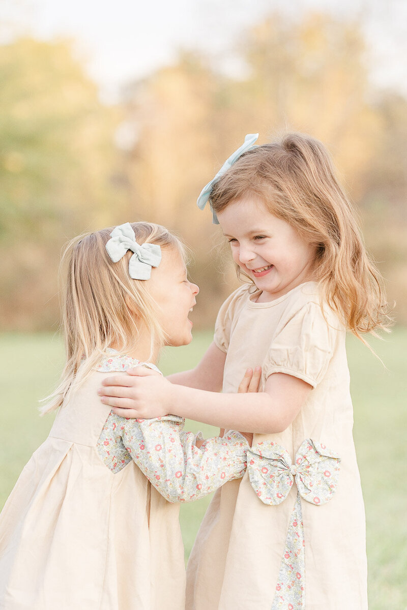 siblings laughing during fall mini session taken by a NoVA photographer