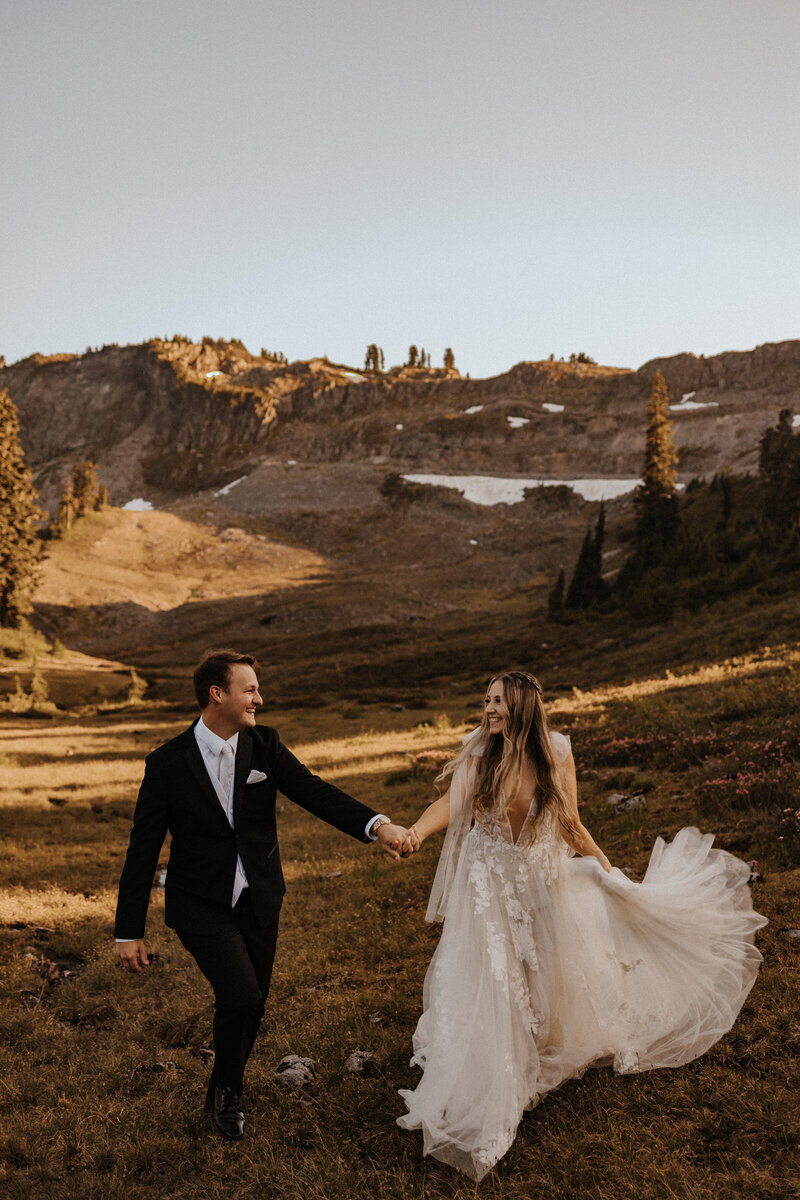 Bride and groom on a mountain during intimate elopement